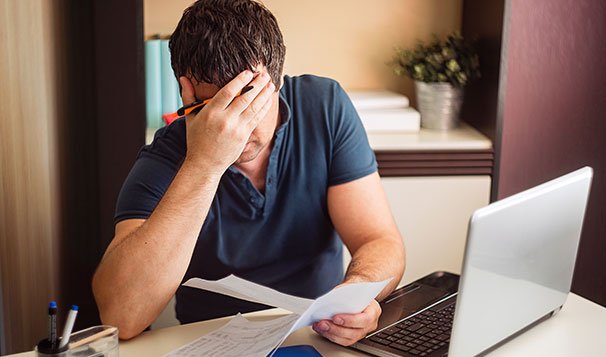 business owner feeling sad about his bankrupt business